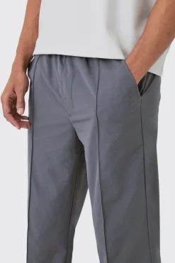 boohooMAN Elasticated Technical Stretch Relaxed Pintuck Trouser | UK| Trousers
