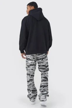 boohooMAN Slim Stacked Flare Heavily Distressed Camo Trouser | UK| Trousers|Cargos