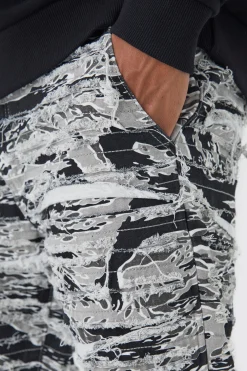 boohooMAN Slim Stacked Flare Heavily Distressed Camo Trouser | UK| Trousers|Cargos