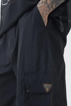 boohooMAN Tall Crinkle Nylon Cargo Parachute Trousers In | UK| Trousers