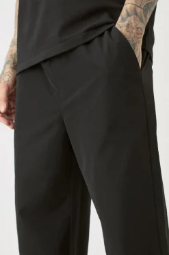 boohooMAN Tall Elasticated Lightweight Technical Stretch Relaxed Fit Trousers | UK| Trousers