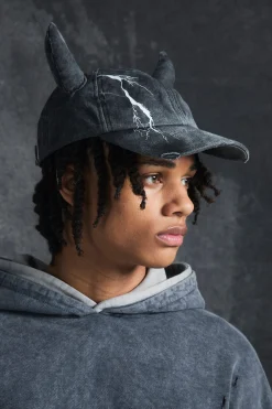 boohooMAN Trippie Redd Graphic Print Distressed Horn Cap In | UK| Hats & Caps